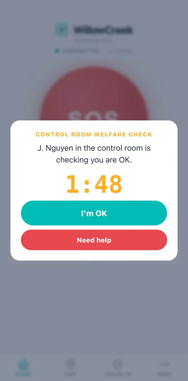 A welfare check from the control room on the handset, naming the operator who is asking, with a grace countdown and the same two buttons.